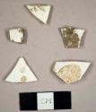 Whiteware sherds, including one rim sherd to a cup