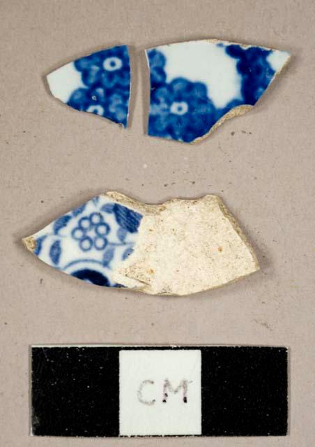 Blue transfer print whiteware sherds, two mend together