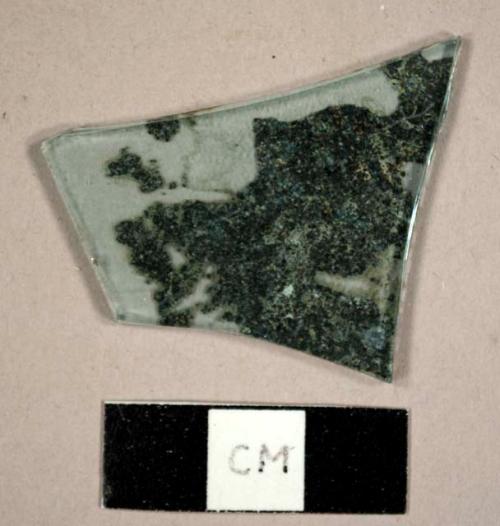 Mirror glass fragment with some silvering remaining