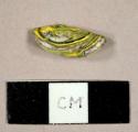 Green and yellow glass fragment with possible ceramic inclusions