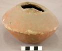 Small pottery jar with red slip