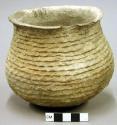 Corrugated pottery jar