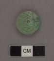 One fragment of small carved jade disc. About 20 mm. diam x 2mm