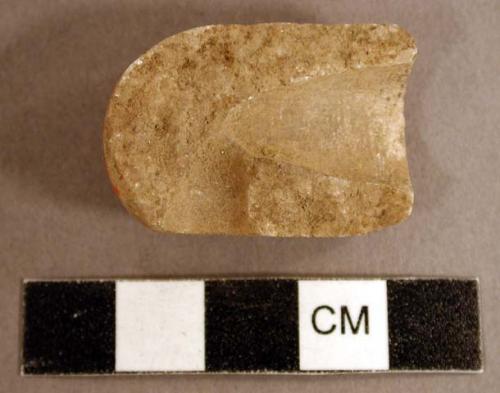 Ground stone, pipe fragment, translucent stone
