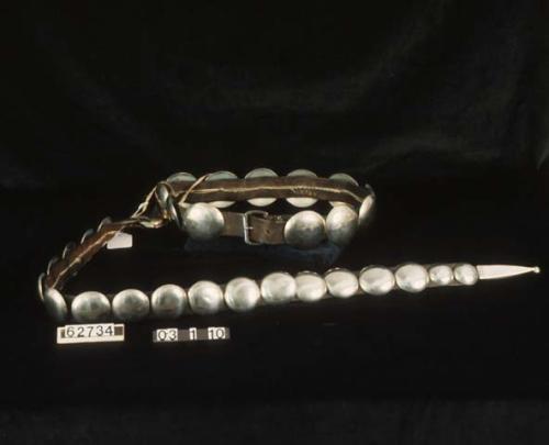 Silver concho belt.