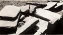 Photograph of Pucara ruins; piles of slabs during excavations of sunken courts, Area 6