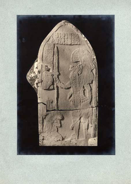 Stela 20 from Structure 41 (South Temple III), showing warrior in tiger helmet and a man with tiger skin on his back