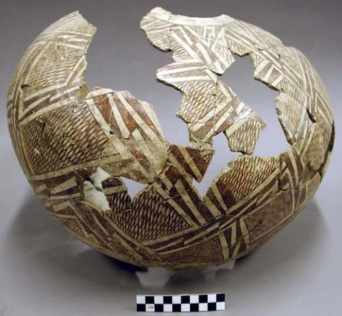 partial jar, brown on white exterior, mended, 36 sherds with it