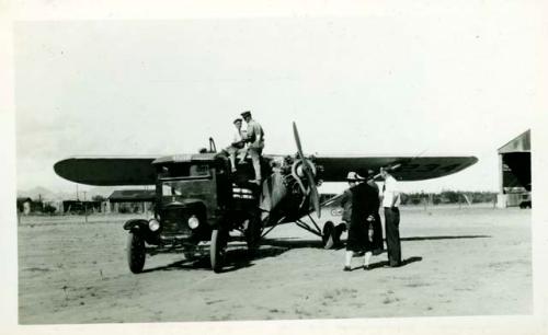 Scan of photograph from Judge Burt Cosgrove photo album.Plane in which Burton flew over from San Diego.