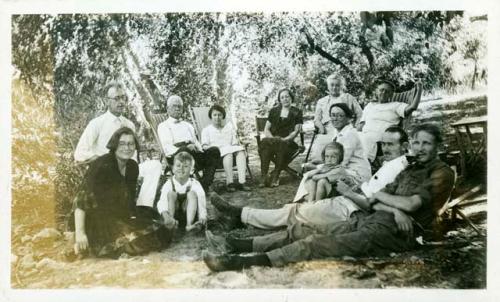 Scan of photograph from Judge Burt Cosgrove photo album.Blanch Garvin White and Children C.B.Cosgrove Prof Luther Foster. Fannie French Beth Foster. Mrs.L.B.Morrill Mrs. Luther Foster Mrs.C.B.Cosgrove C.B.Cosgrove Jr. Arthur Peterson. July 17-1927 Swarts Camp.