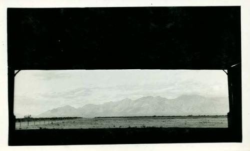 Scan of photograph from Judge Burt Cosgrove photo album.Santa Catalina Mts. North Tucson Ariz. from airport hanger.