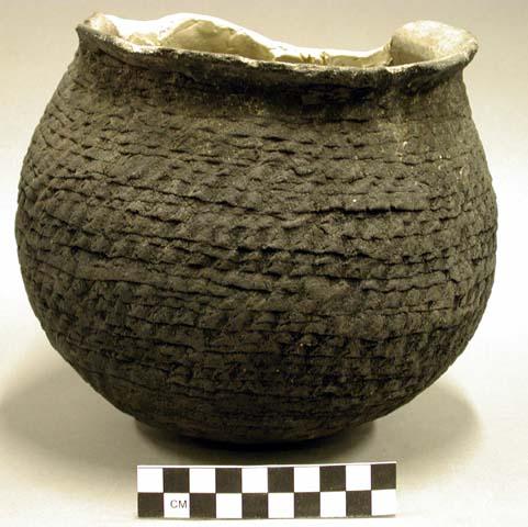 Corrugated pottery jar--restorable
