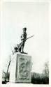 Scan of photograph from Judge Burt Cosgrove photo album.Concord Mass. Statue of Minute Man faces the bridge
