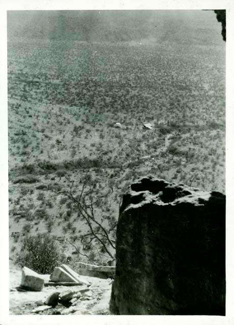 Scan of photograph from Judge Burt Cosgrove photo album.  Camp from Cave 7 Hueco Mts. N.E. of El Paso Tex. July 1928.