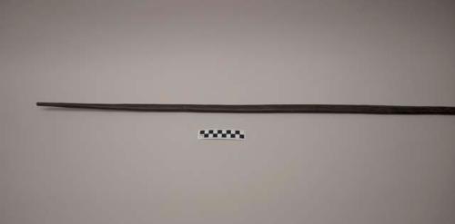 Wood bow with tapered pointed ends, dark in color