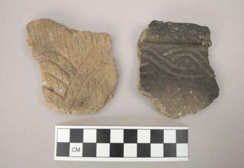 Rim or body sherds, parallel incised curvilinear designs, cord impressed on one sherd