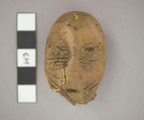 Carved ivory human head