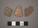 11 potsherds - painted on light, slip in and out (B5)