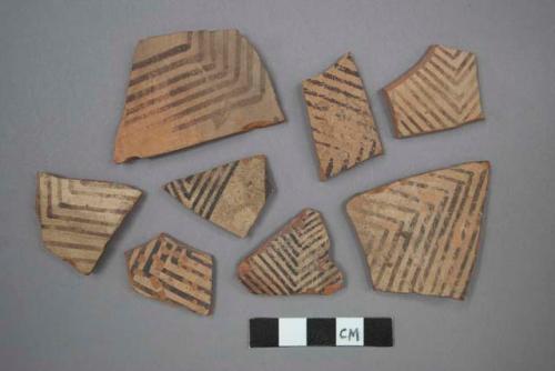 11 potsherds - painted on light, slip in and out (B5)