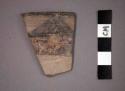 Ceramic rim sherd of bowl, painted designs both sides