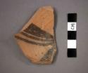 Ceramic base sherd with black designs on interior