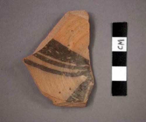 Ceramic base sherd with black designs on interior