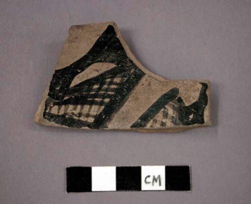 Ceramic base sherd of bowl, black painted designs on interior