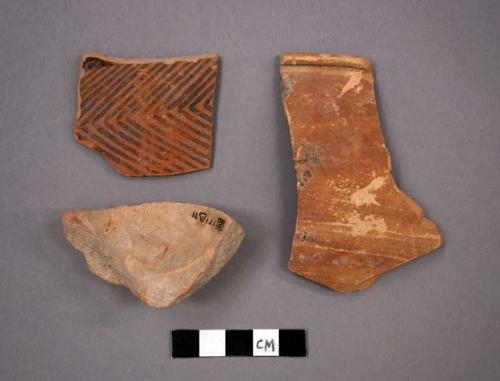 Ceramic sherds, rim or body or base, body sherd has design on exterior