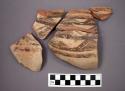 Ceramic jar sherds, flared rim, painted designs with cross-hatching, most will mend together