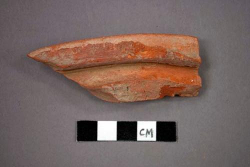 Ceramic rim sherd from jar?, lipped rim, with red pigment?