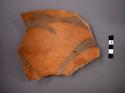Ceramic rim sherd of bowl, includes portion of base, painted designs on interior, mended
