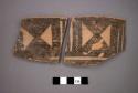 Ceramic rim sherds, black geometric designs on both sides, will mend together