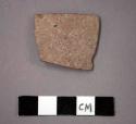 Ceramic body sherd, pinkish in color