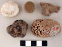 Debitage, graphite fragment, coral fragment, pebble, chalcedony and crinoid stem