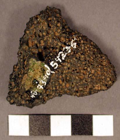 Fragment. possible rasping stone?. triangular fragment. vesicular basalt.