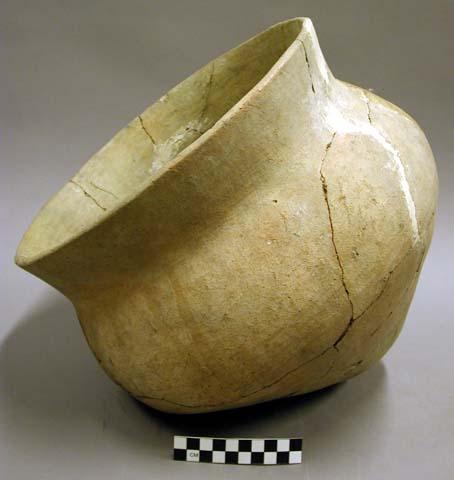 Ceramic jar, flared rim, conical base, reconstructed