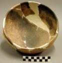 Jeddito black on orange pottery bowl--restorable?