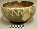 Ceramic bowl, black on yellow interior, white on brown exterior,7 sherds inside