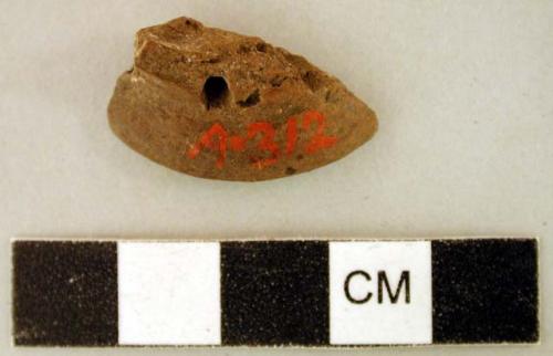 Earthenware fragment with rim and perforated hole, likely ear spool fragment