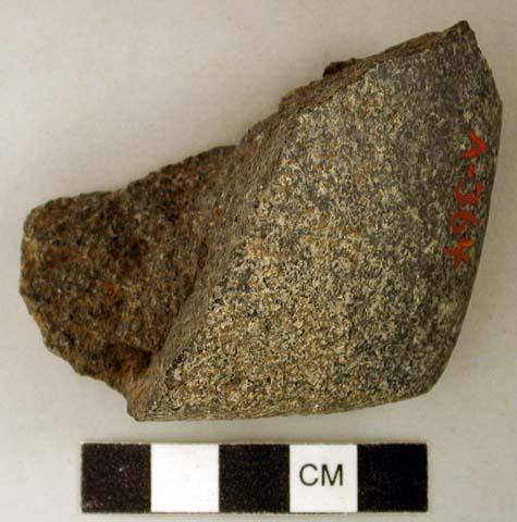 Ground stone, edged tool fragment, likely axe or adze