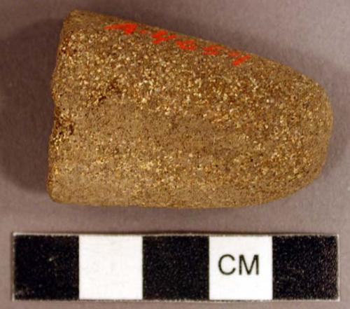 Ground stone, abrading stone fragment, grooved on two sides