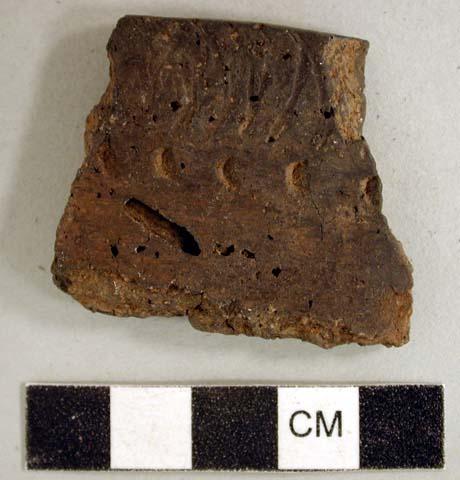 Coarse earthenware rim sherd, rocker dentate and punctate