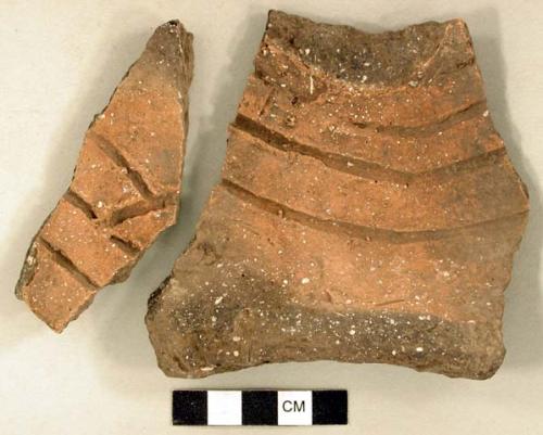 Ceramic, earthenware body and rim sherds, incised, shell-tempered; two sherds crossmend