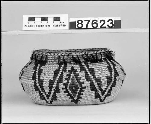 Feathered oval basket from the collection of Mrs. H.S. Grew. Coiled, three-rod foundation, non-interlocking stitches.