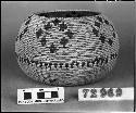 Globular bowl from the collection of G. Nicholson. Coiled, split stitches.