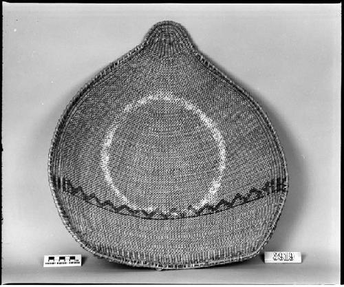 Winnowing or gambling tray from the collection of W.Z. Park. Diagonal twined, painted circles.