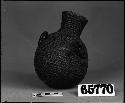 Water jug from the collection through G. Nicholson. Coiled, two-rod foundation, pitched.