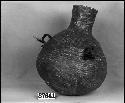 Water jug from the collection of T.V. Keam, 1892. Coiled, two-rod foundation, interlocking stitches, pitched.