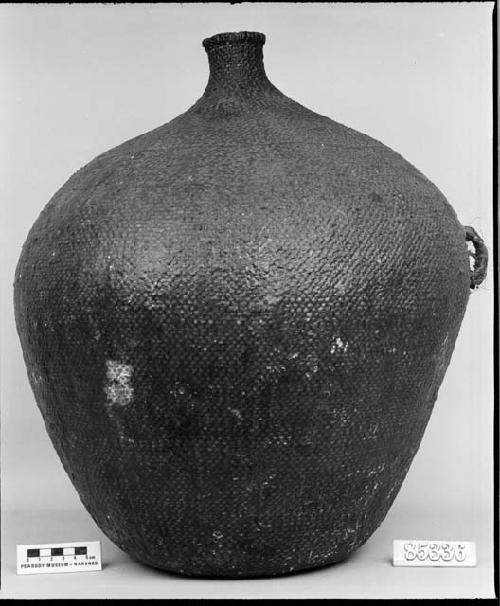 Water jug from the collection of G. Nicholson. Diagonal twined, pitched.