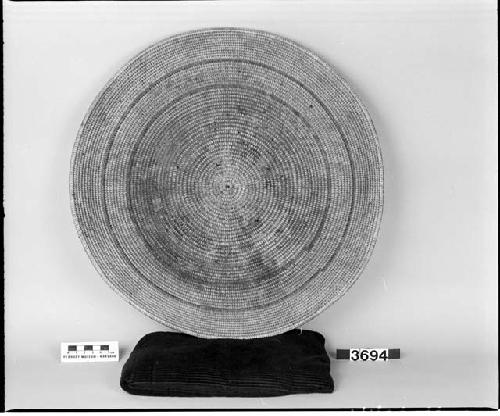 Circular tray made by Maggie Snyder, from the collection of I.T. Kelly. Coiled, three-rod foundation.